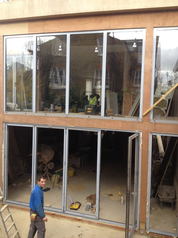 Aluminium bi-fold doors with two-storey glazing in Finchley Central