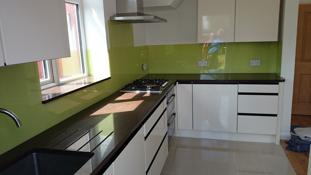 Lime green glass kitchen splashback installed by Finchley Central glaziers