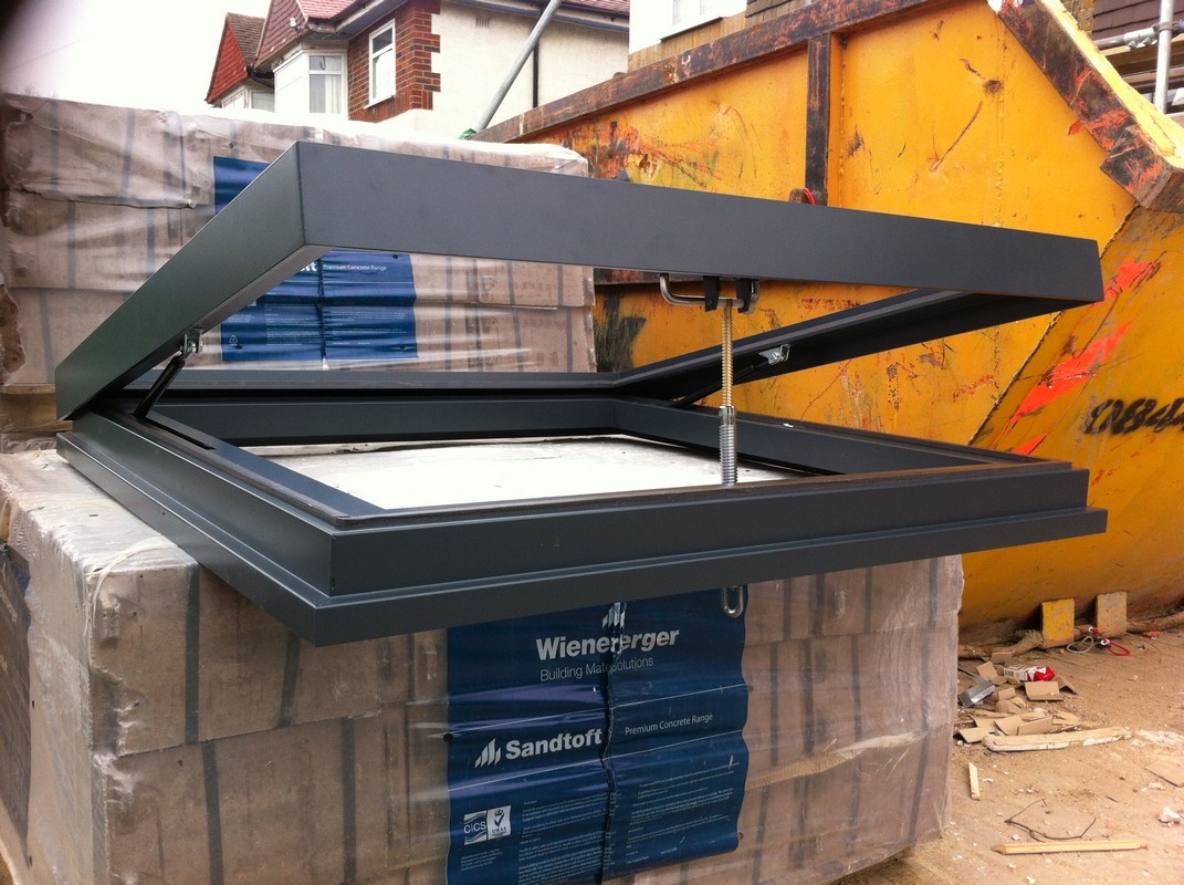 Opening flat roof skylight in anthracite grey installed in Finchley Central