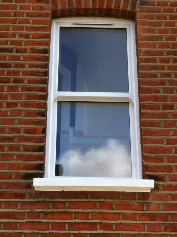 uPVC sash window on Victorian red brick house in Finchley Central